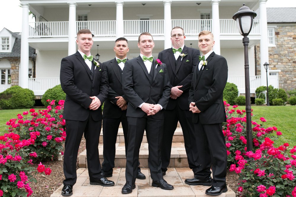 Groom and groomsmen on the steps of the Inn at Evergreen