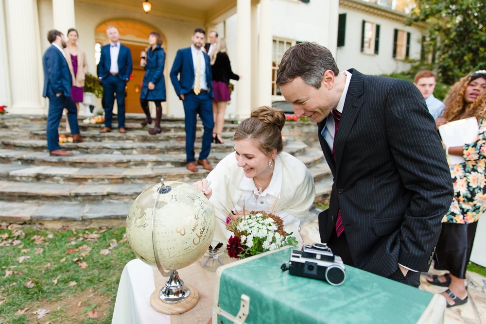 Guests signing wedding guestbook