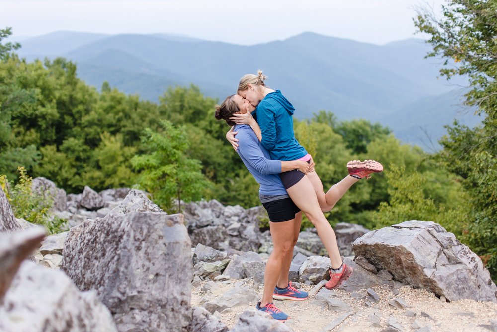 LGBT couple kisses in the mountains