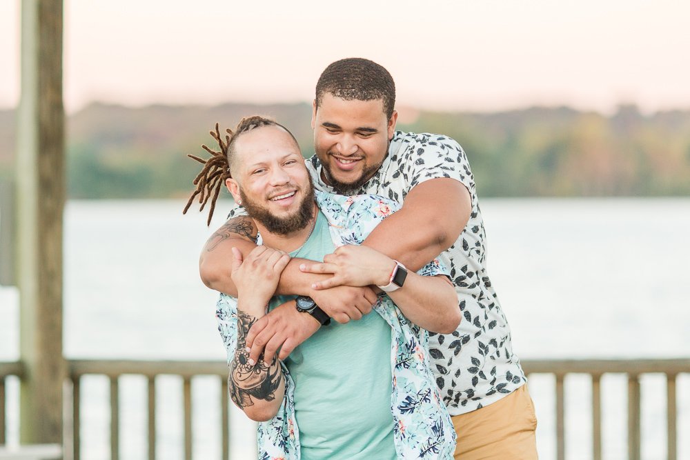 Laughing gay couple on the Potomac River