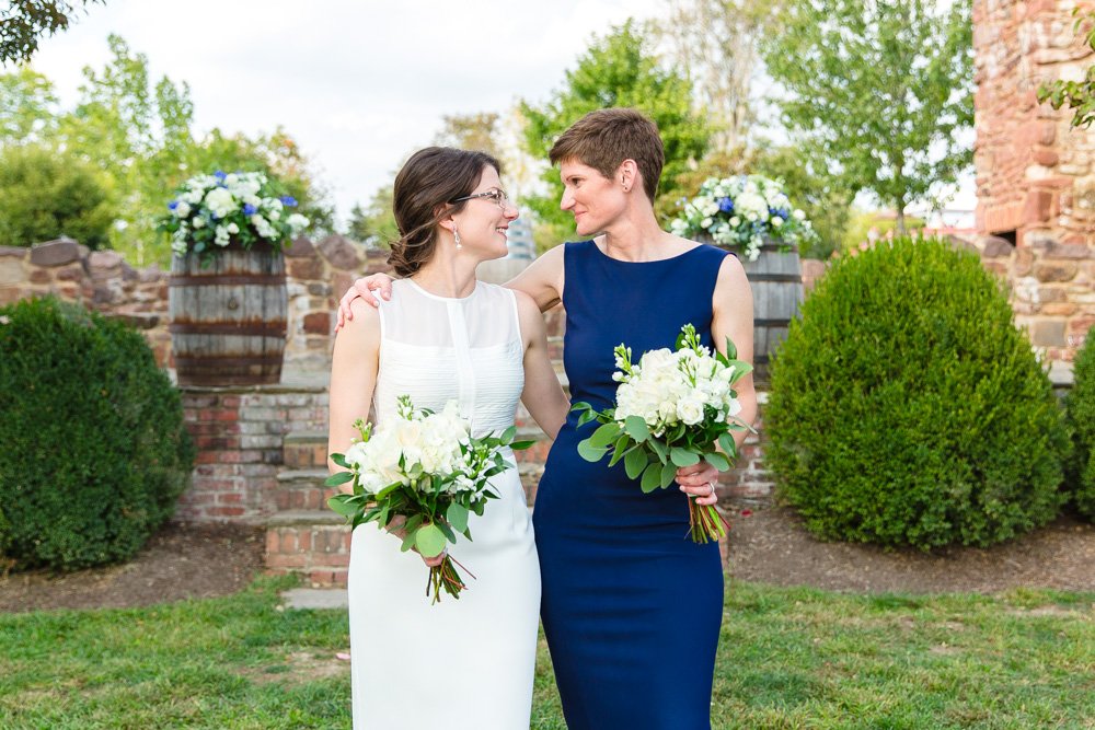 Two brides in front of the Hillwood Ruins