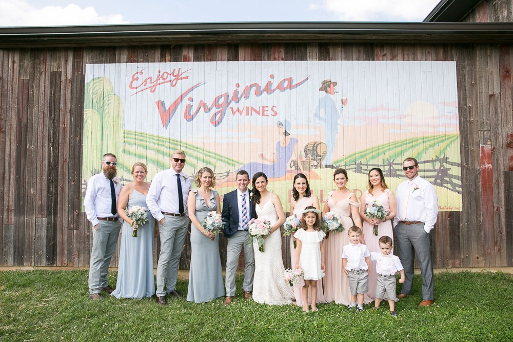 Blush and blue wedding party at the Virginia Wines mural