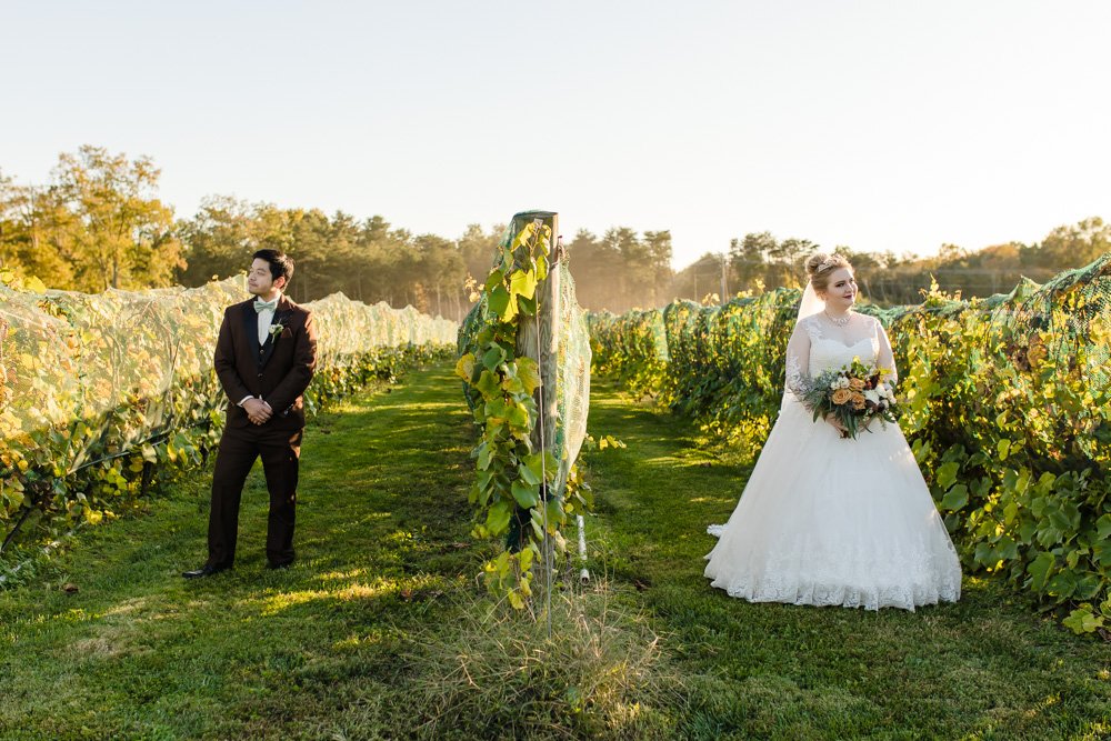 Bride and groom posing in the vines