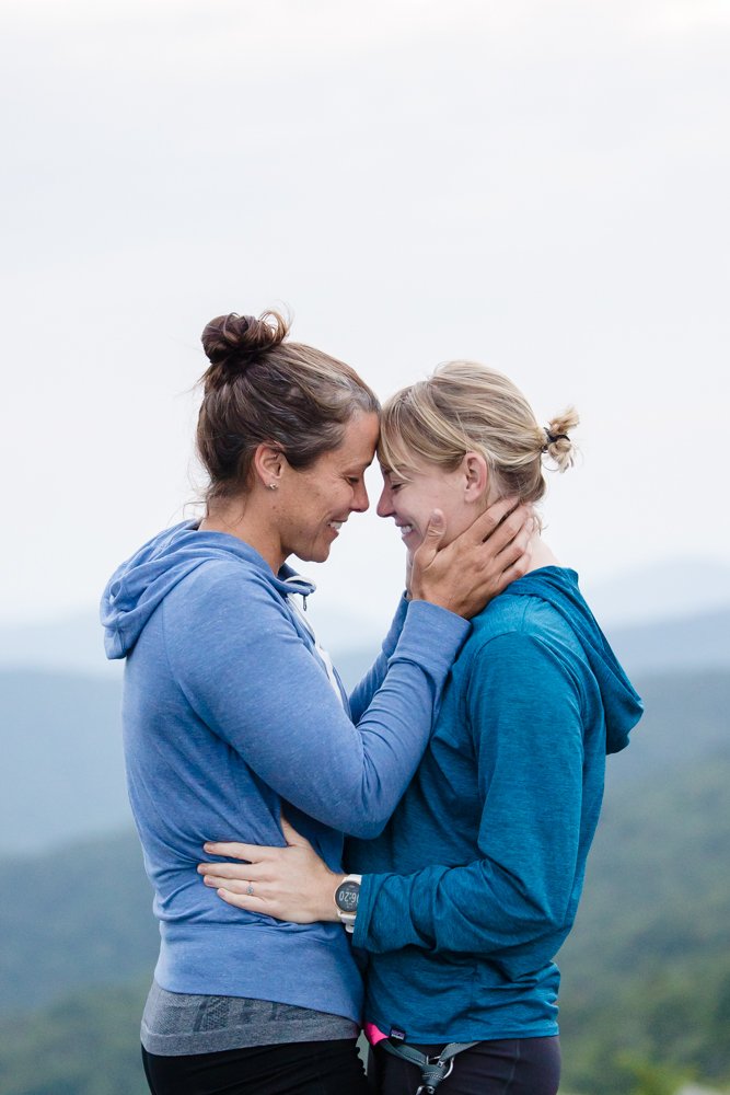 Hiking engagement photo with two women