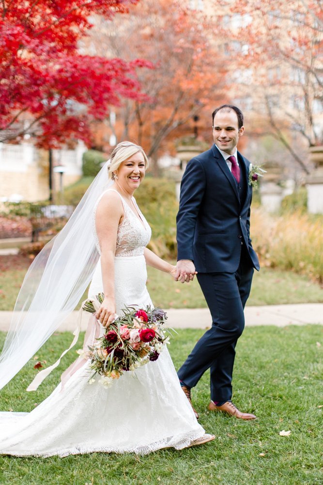 Wedding couple walking while holding hands