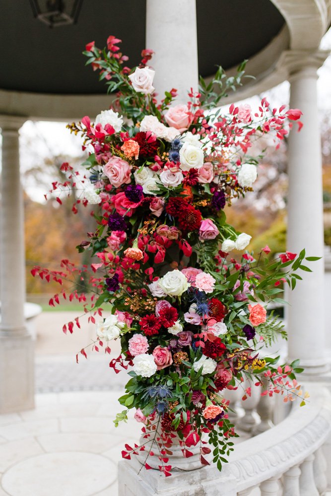 Burgundy, red, and pink floral bouquet for fall wedding ceremony
