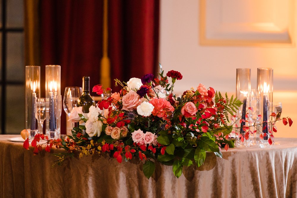 Sweetheart table floral decor and candles
