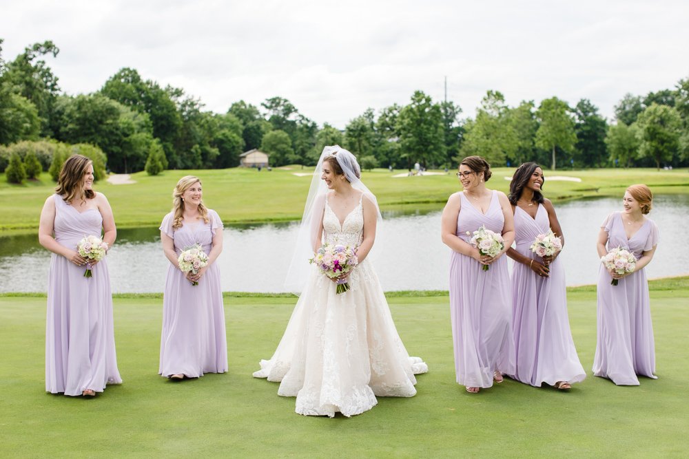 Bridal party walking across the golf course