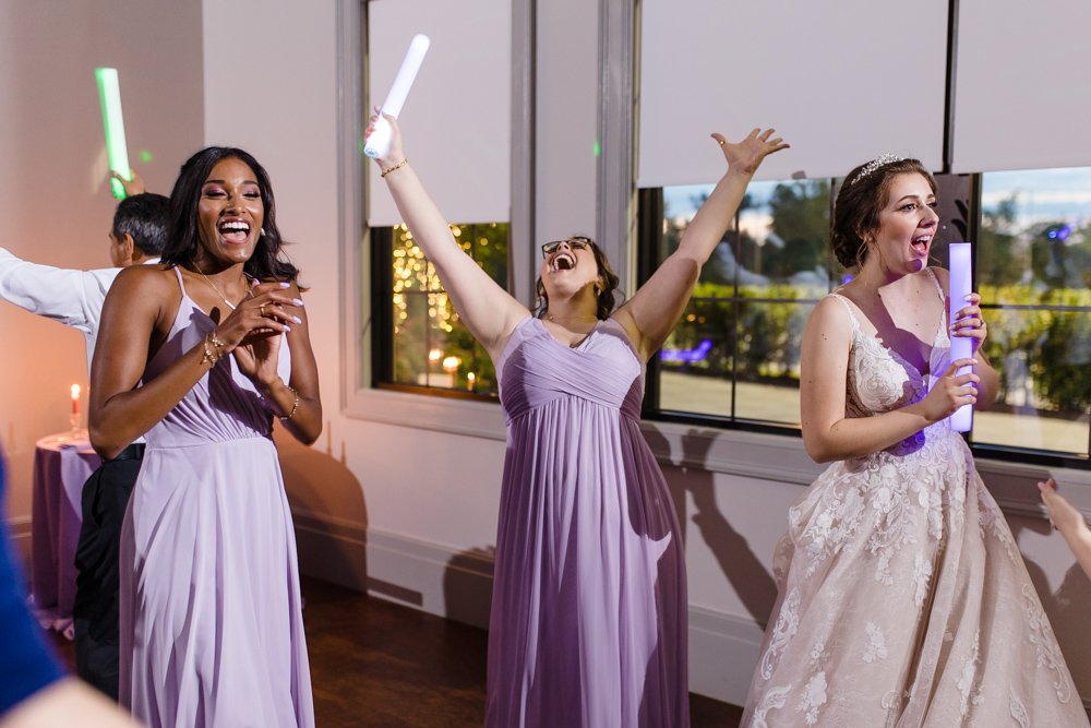 Bride and bridesmaids dancing during reception