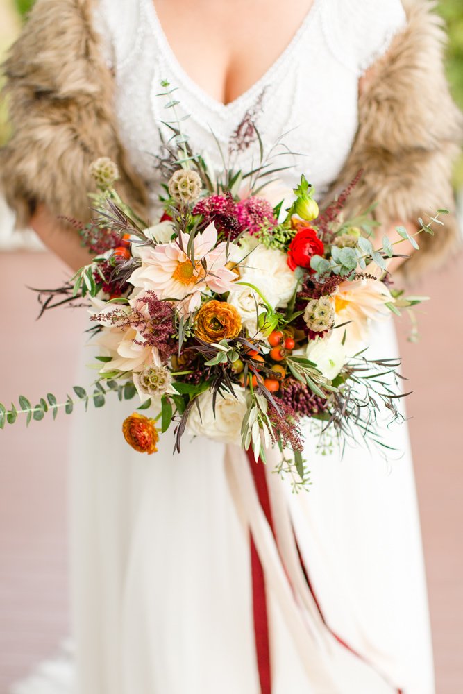 Fall bridal bouquet with reds and oranges