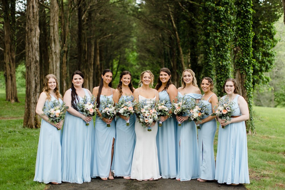  Bride and bridesmaids in light blue bridesmaid dresses 