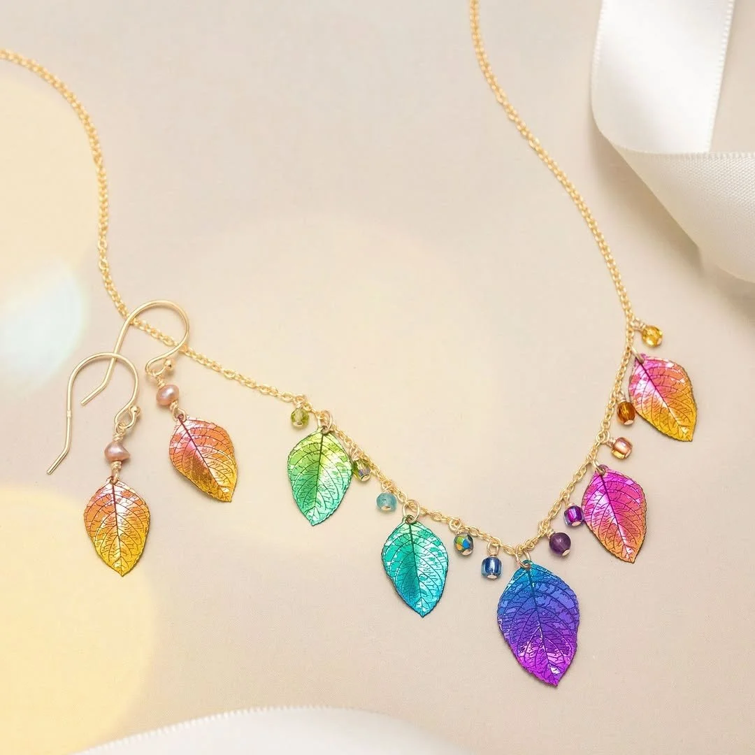 Fall never looked so radiant 🍂✨
This rainbow-hued leaf necklace from @hollyyashi  enhances all the beauty of the season in one stunning piece. Find it at @accessoriestheshowroom  Showroom #304, and see all the gorgeous fall colors at the Fall Buying