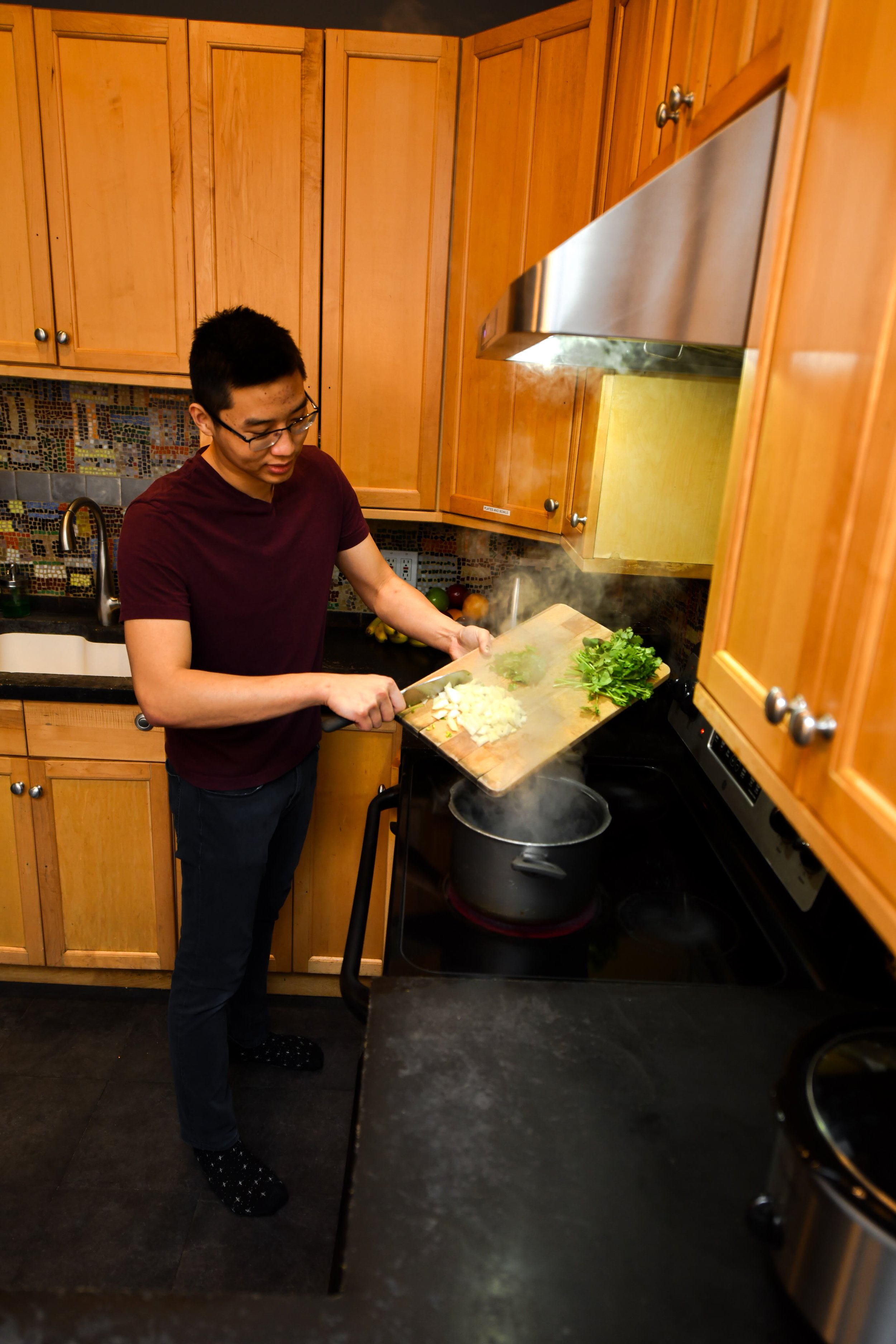 Subletinn Francis Apartment Kitchen in Use to make delicious Dinner