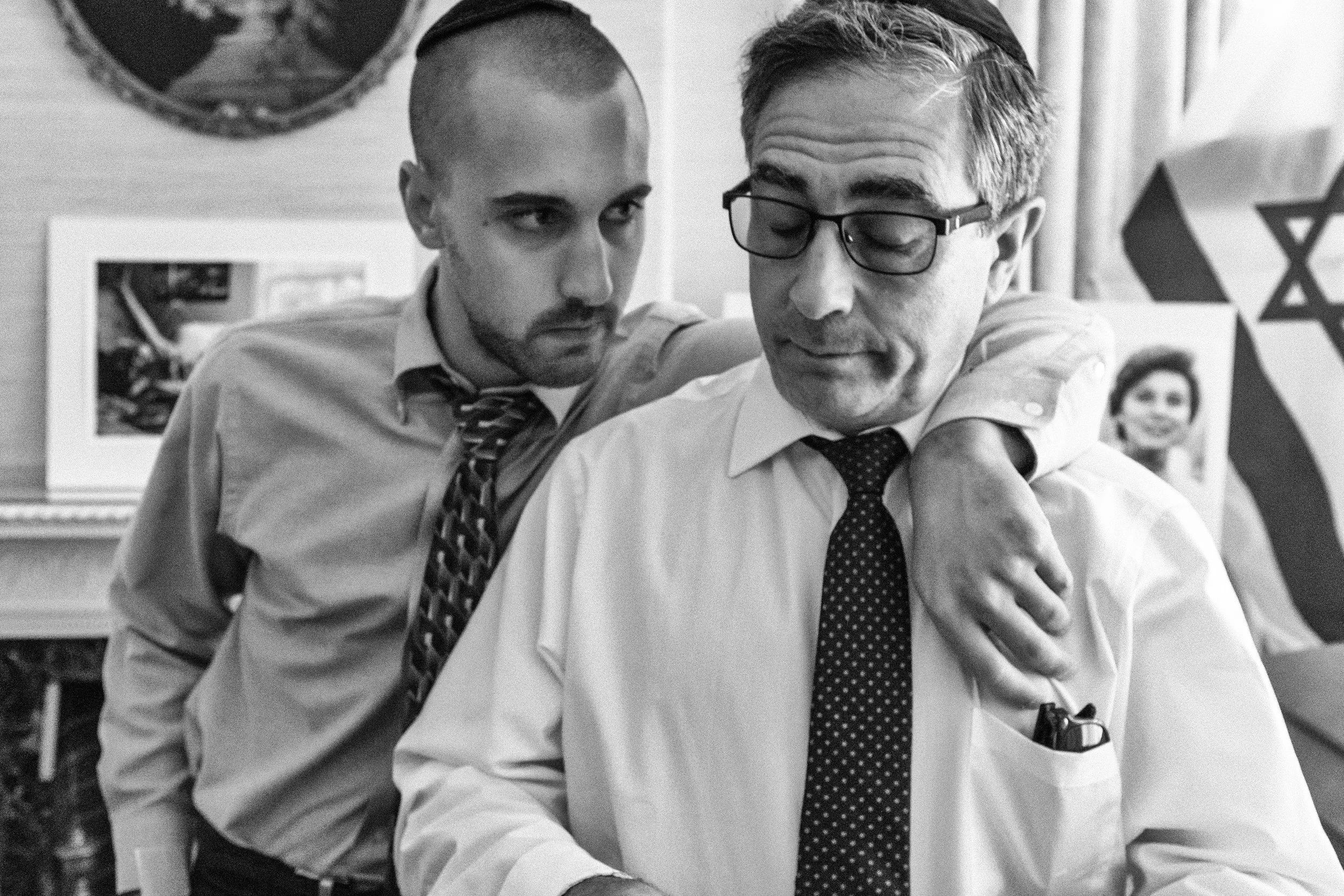 Son comforts father