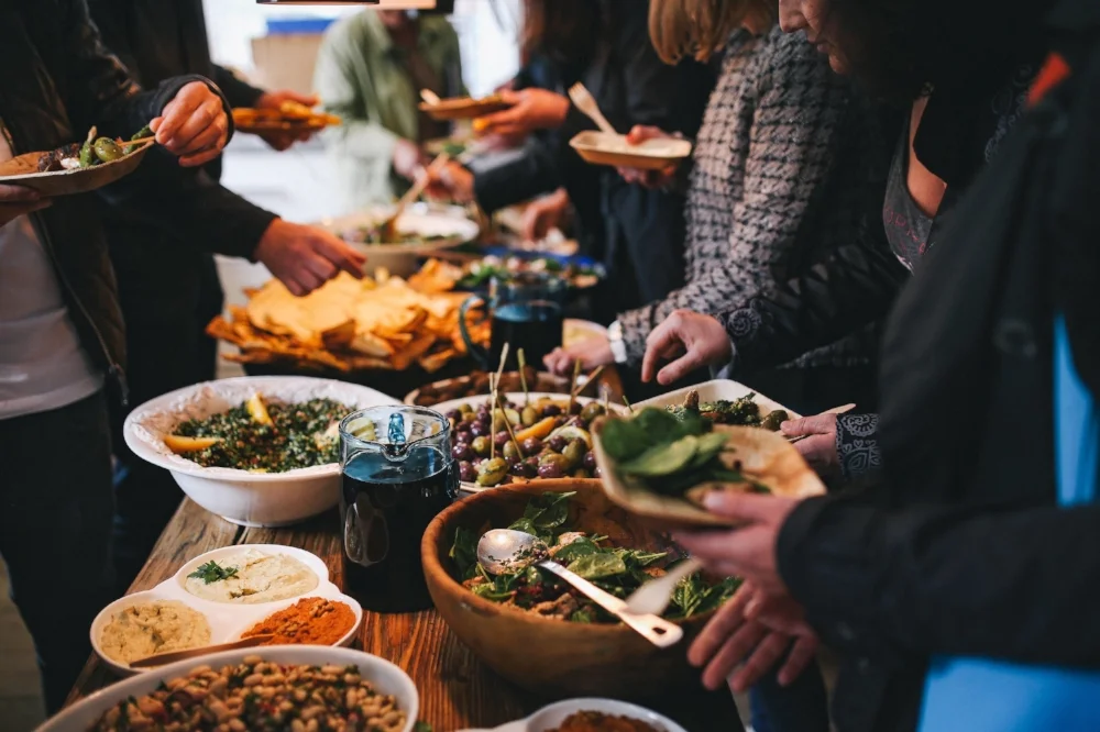 foodiesfeed.com_people-feasting-on-healthy-salad-buffet.jpg