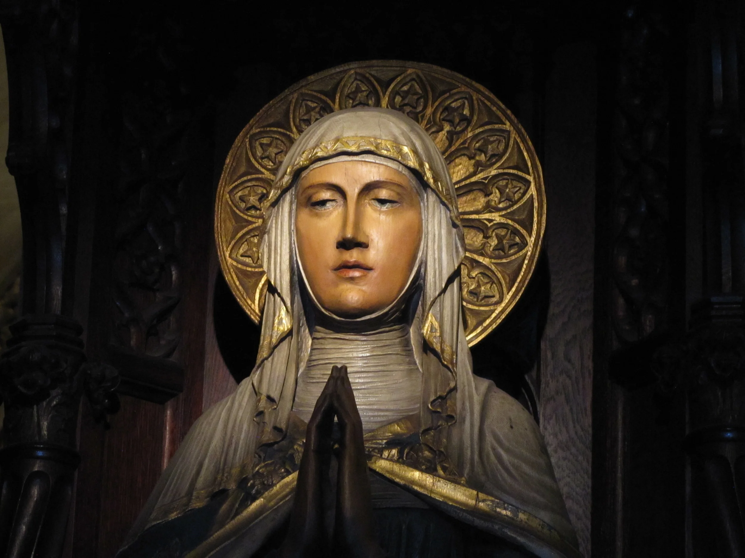 The statue of the Blessed Virgin Mary is by by German master carver Johannes Kirchmayer