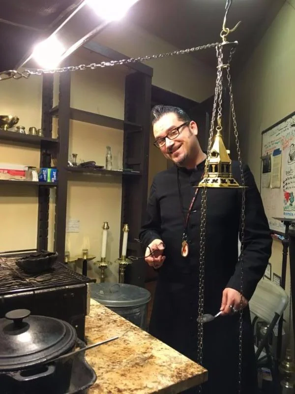 Thurifer Rick Miranda cleaning up the Smoke Room after Solemn Mass