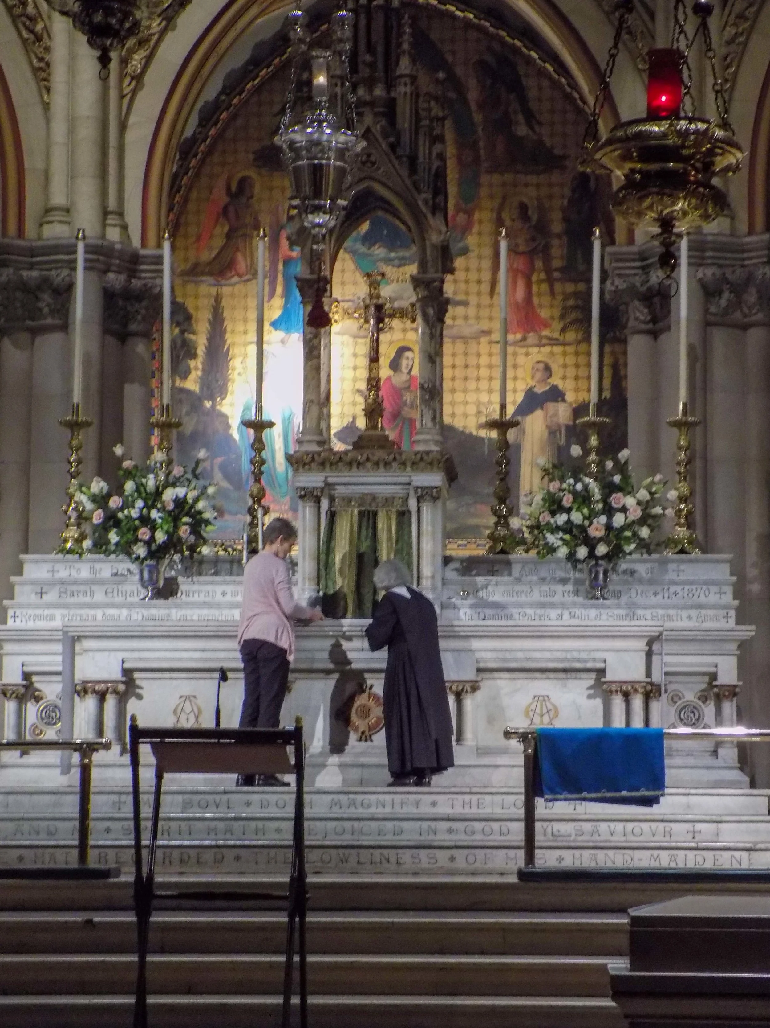 Sr. Laura Katharine and MaryJane Boland changing the fair linen before the Sunday Vigil Mass on Saturday evening. 