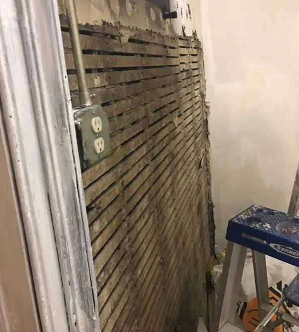 New ceramic tiles will be used on the wall by the grill where the coals are "cooked." 