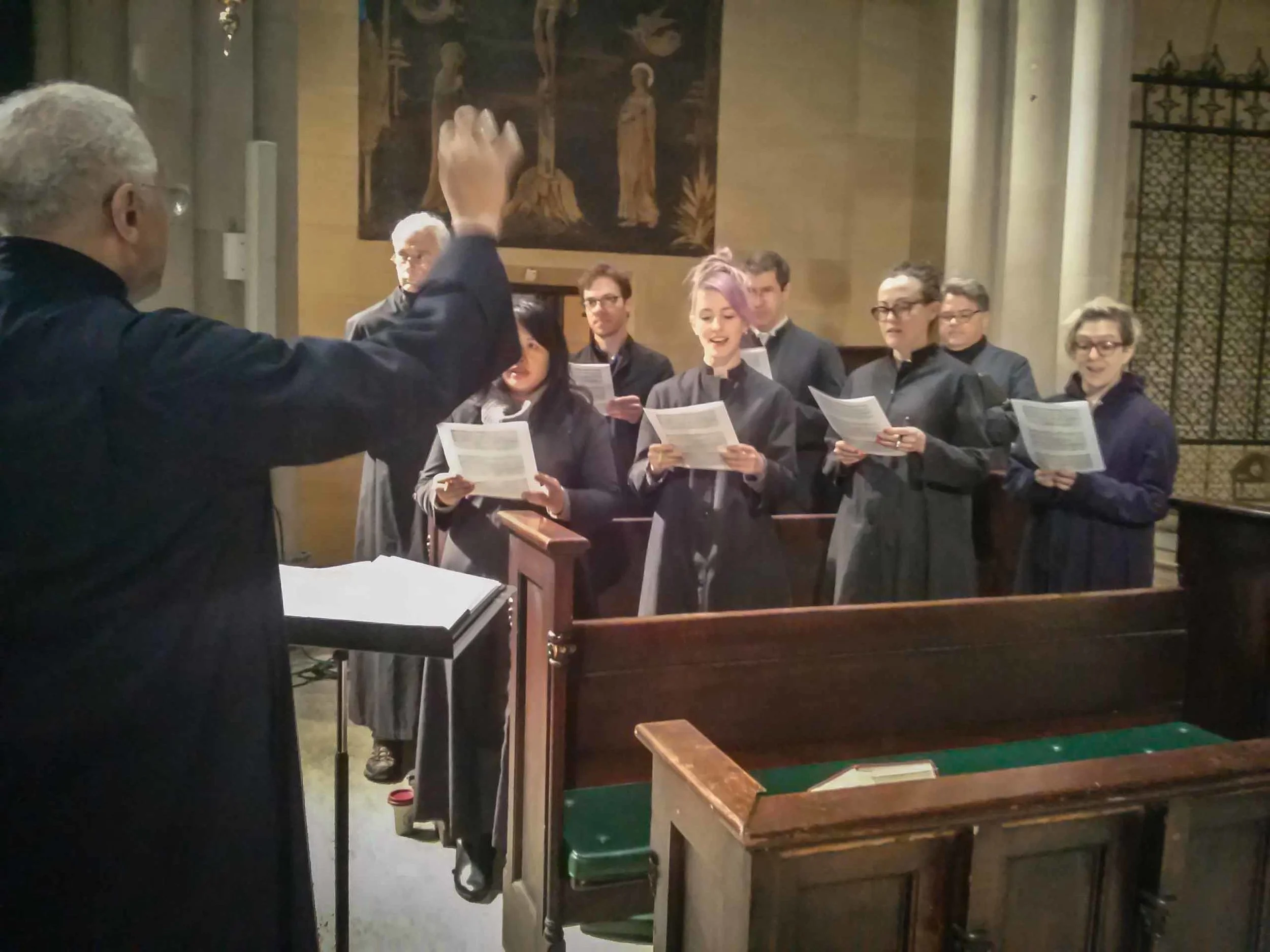 The choir rehearses in the chancel between the Said Masses on Sunday morning during Lent. 