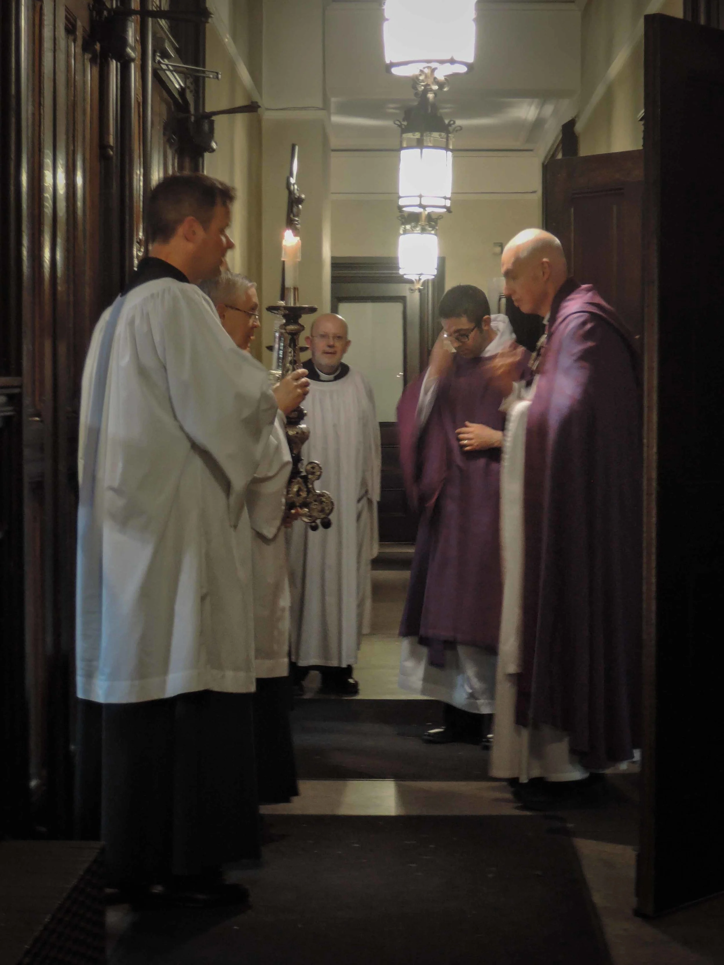 A final prayer in the narthex after Evensong & Benediction.