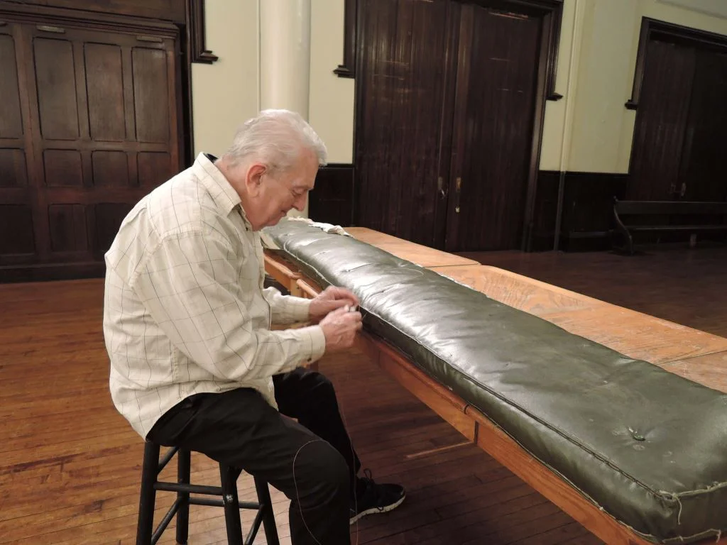 Dick Leitsch repairs kneeling cushions. Thank you, Dick!