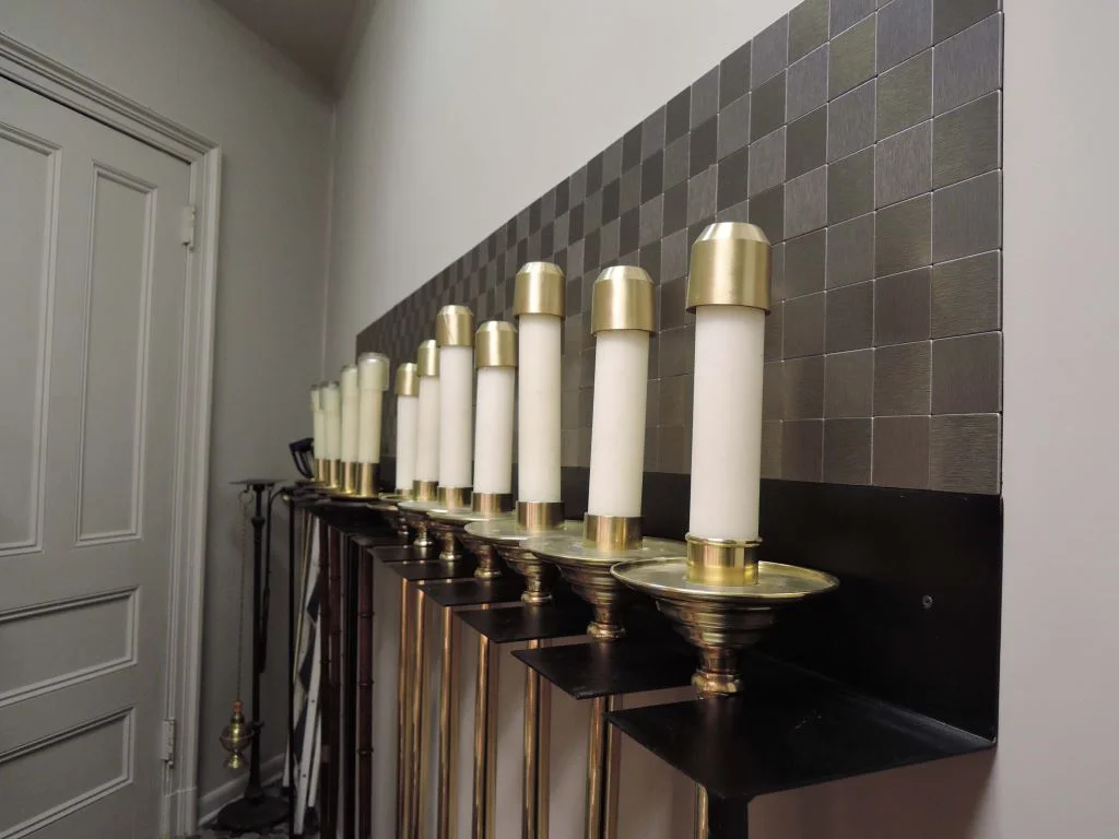 New metal racks for processional torches in the smoke room