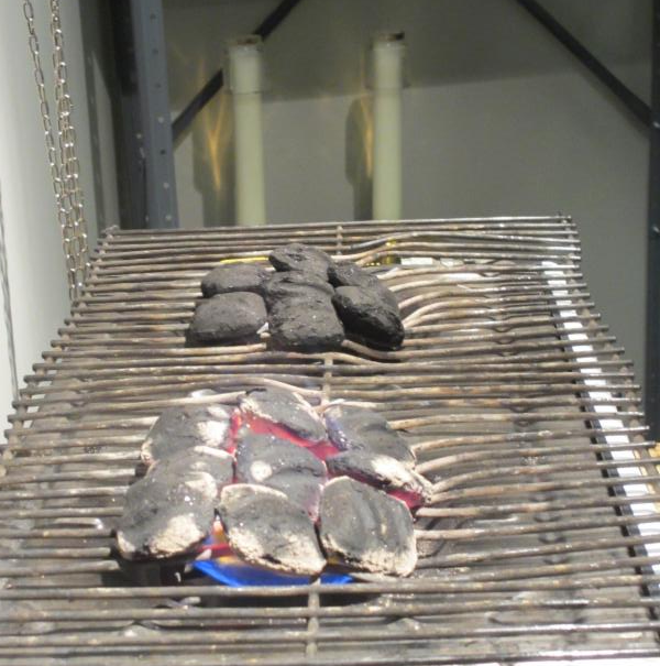 Charcoal being prepared for Mass 