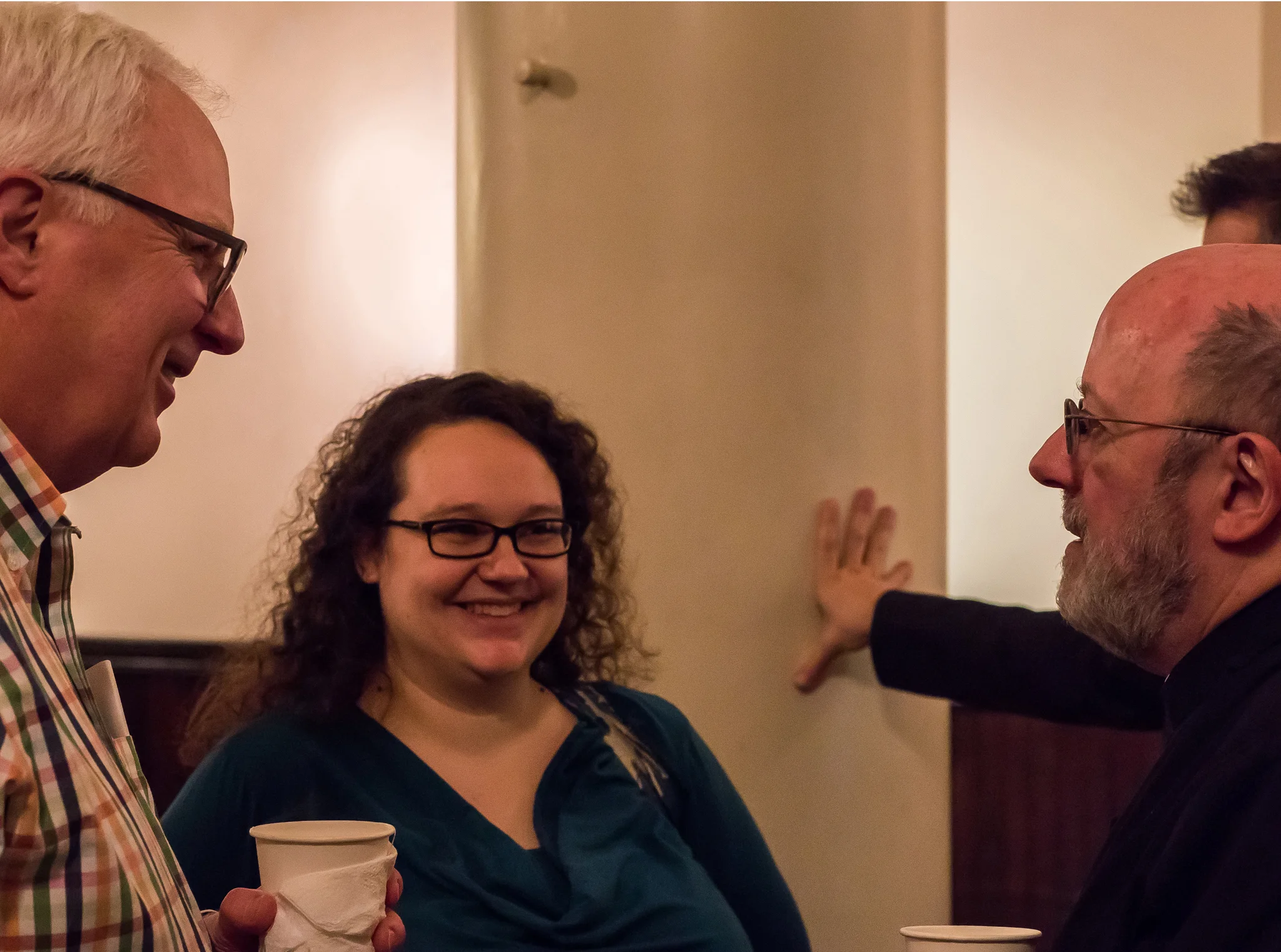 Bob Powell, Reha Sterbin, andFather Jay Smith Photo by Ricardo Gomez