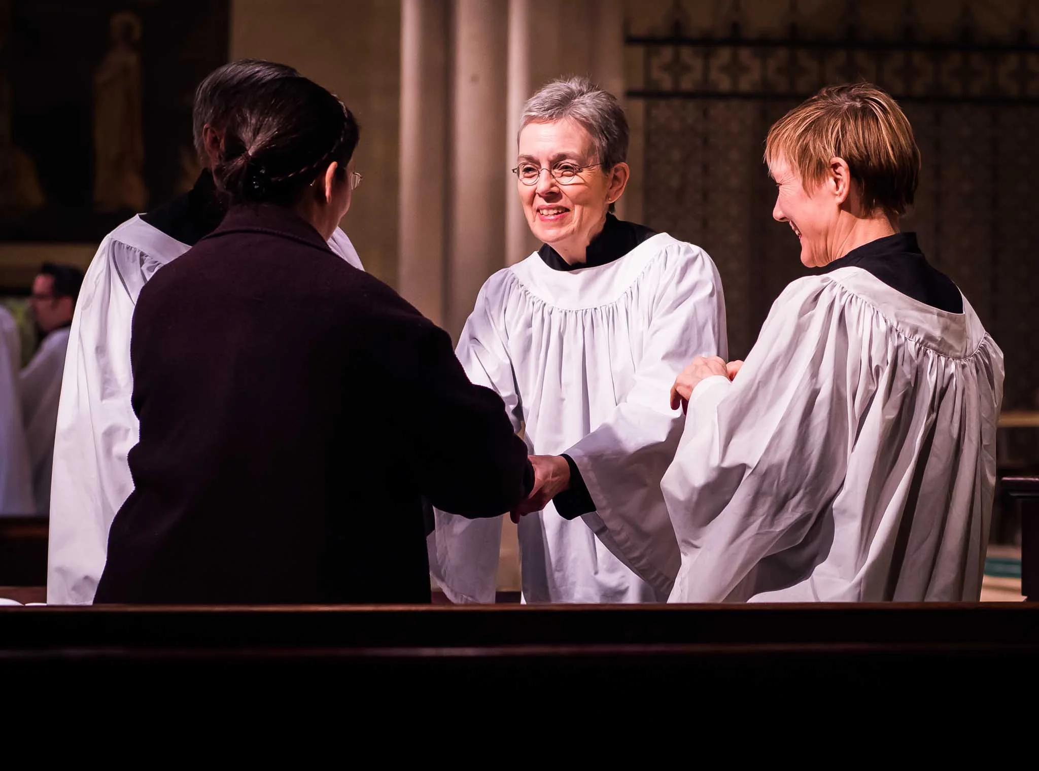 Sharing a sign of Christ's Peace. Photo by Ricardo Gomez 