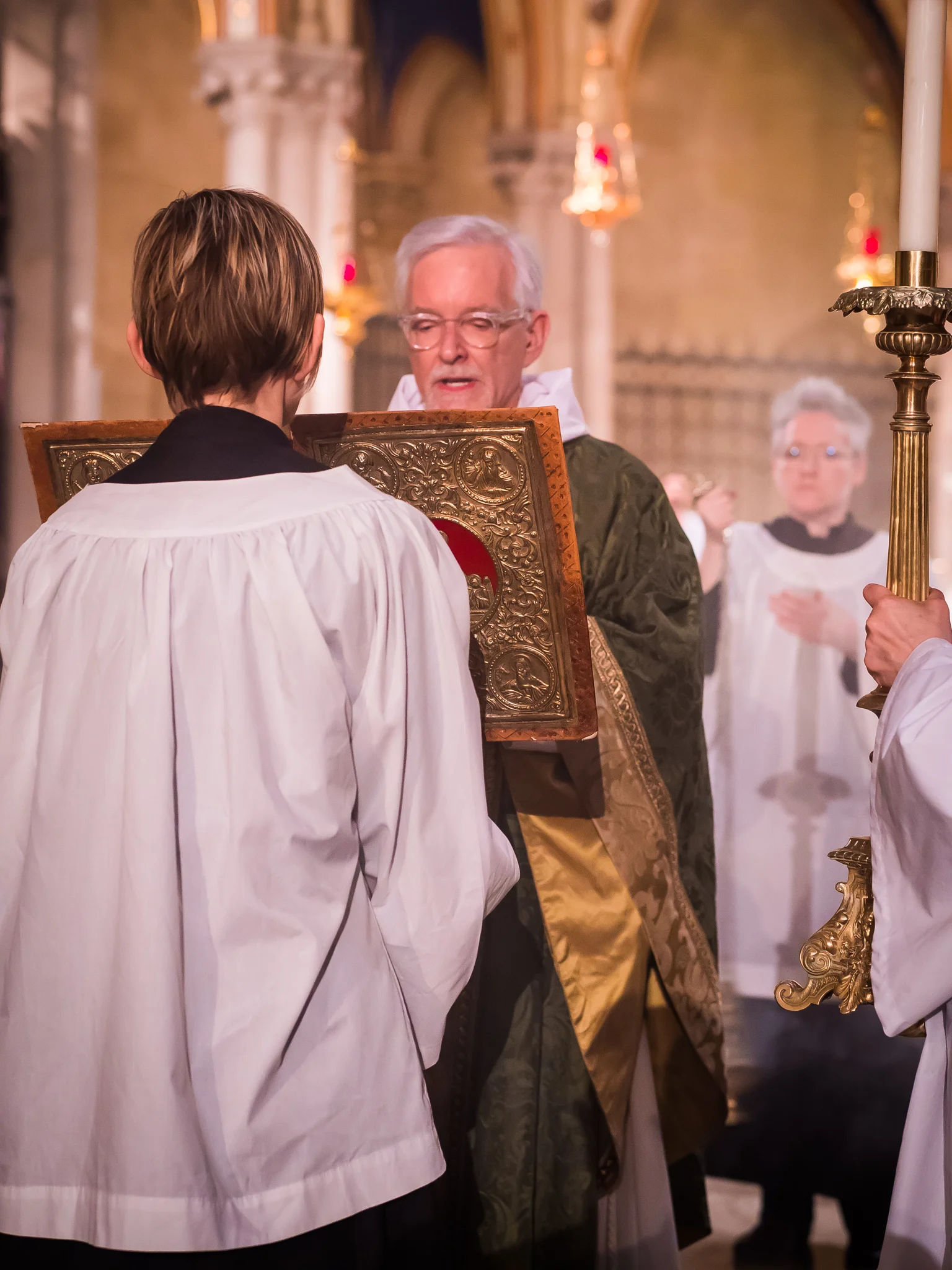 Father Jim Pace was gospeler. Photo by Ricardo Gomez