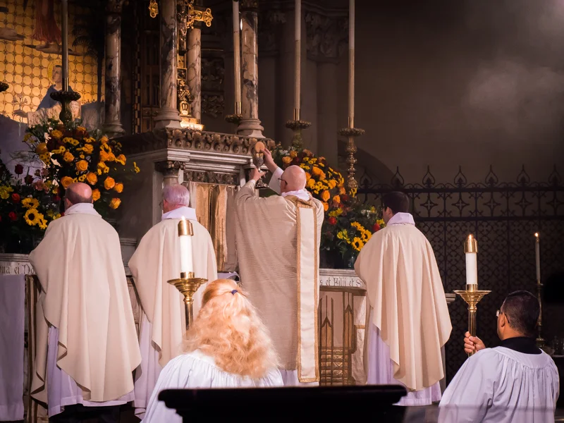 The Bread and Cup are elevated during the final petition of the Eucharistic Prayer until the people have completed the prayer with their "Amen." Photo by Ricardo Gomez