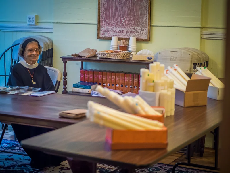 Sr. Laura Katharine, C.S.J.B., held a candle stub sale following the Solemn Mass. Photo by Ricardo Gomez