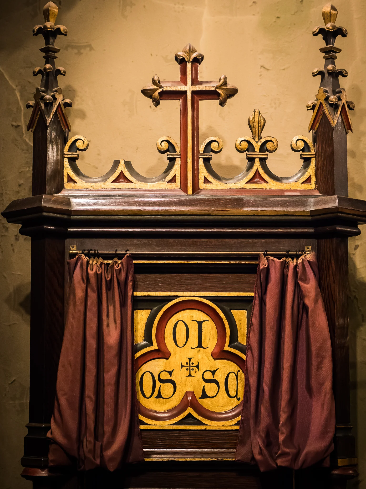 The aumbry in the baptistery where the Oil of the Sick and Chrism are kept. The veil was opened for the taking of this picture. Photo by Ricardo Gomez 
