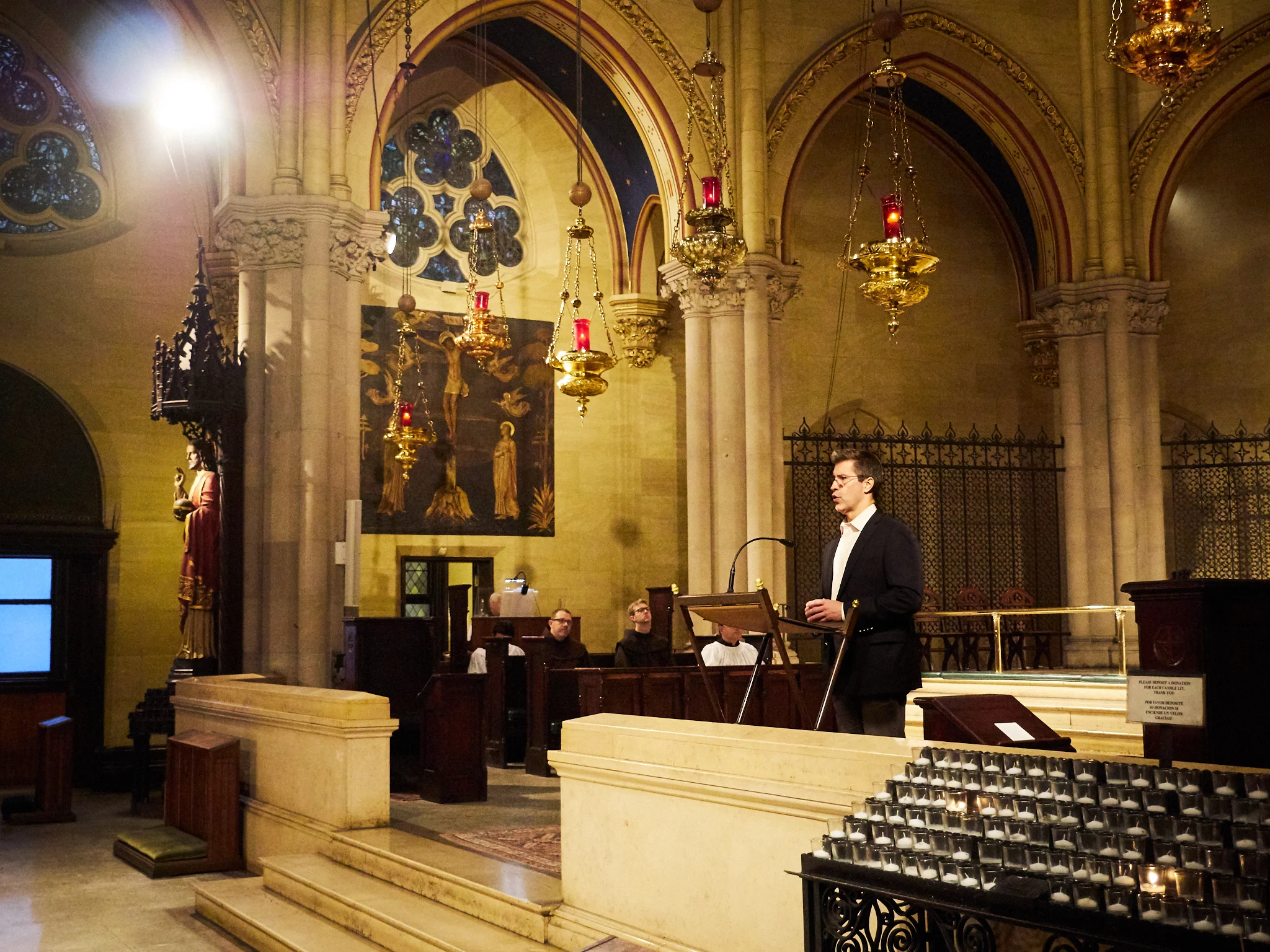Mark Risinger was reader for the Mass. Photo by Ricardo Gomez