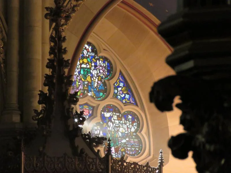 A view of the stained glass window with scenes from the life of St. Ursula, a Cornish princess, shown seated in the upper cinquefoil, seated on a throne with an open book on her lap. The window was a memorial to Ursula Marshall who died at the age of 18, given by her parents. The window is among several works in Saint Mary's by Valentine D'Ogries (1889-1959). Photo by Damien Joseph SSF