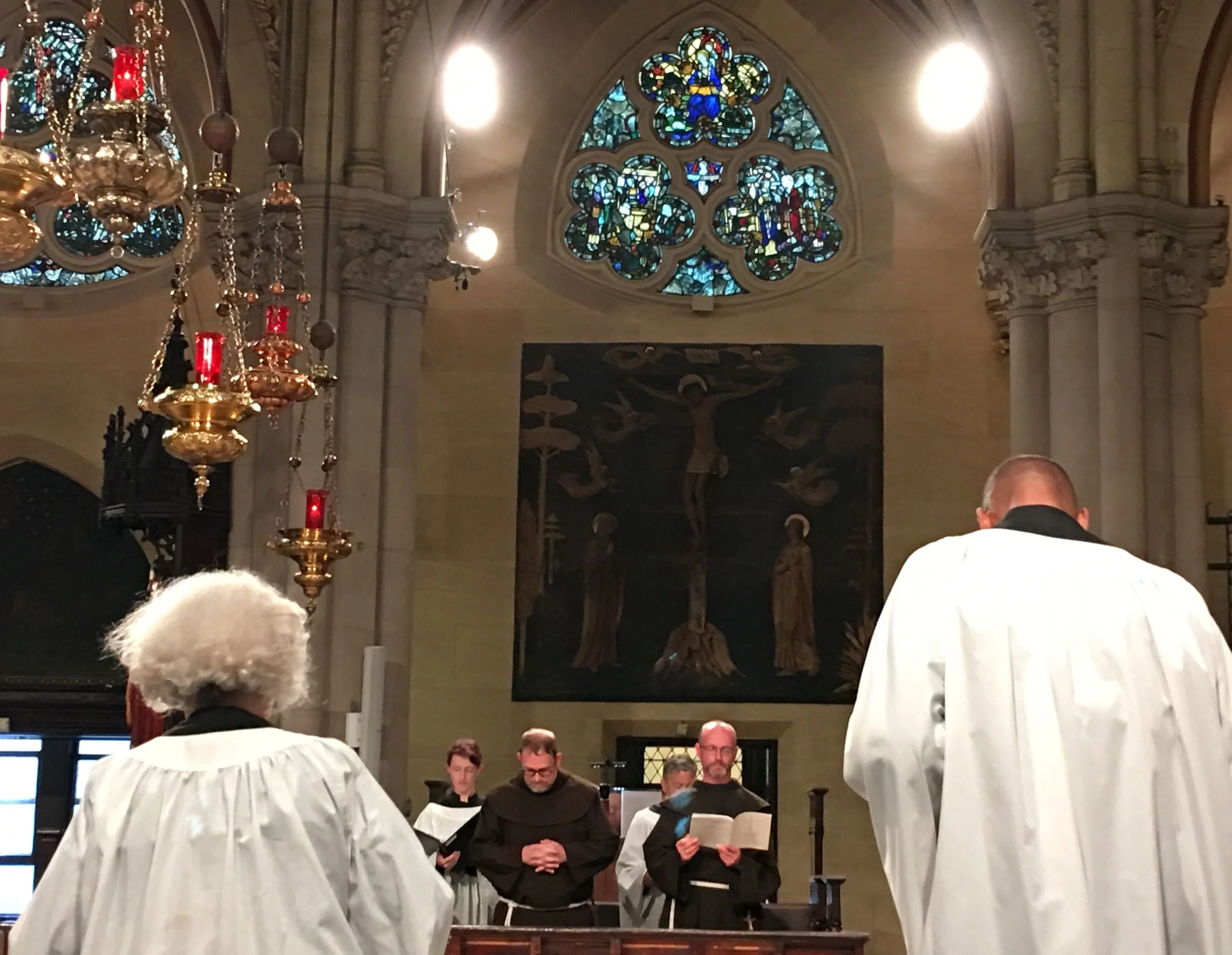 In choir, at the Solemn Mass: in the foreground, from the back (l. to r.): acolytes Julie Gillis and Charles Carson; in the background, facing front (l. to r.): Cantor Charlotte Mundy, Brother Damien Joseph SSF and Brother Desmond Alban SSF. Photo: Renée Pecquex