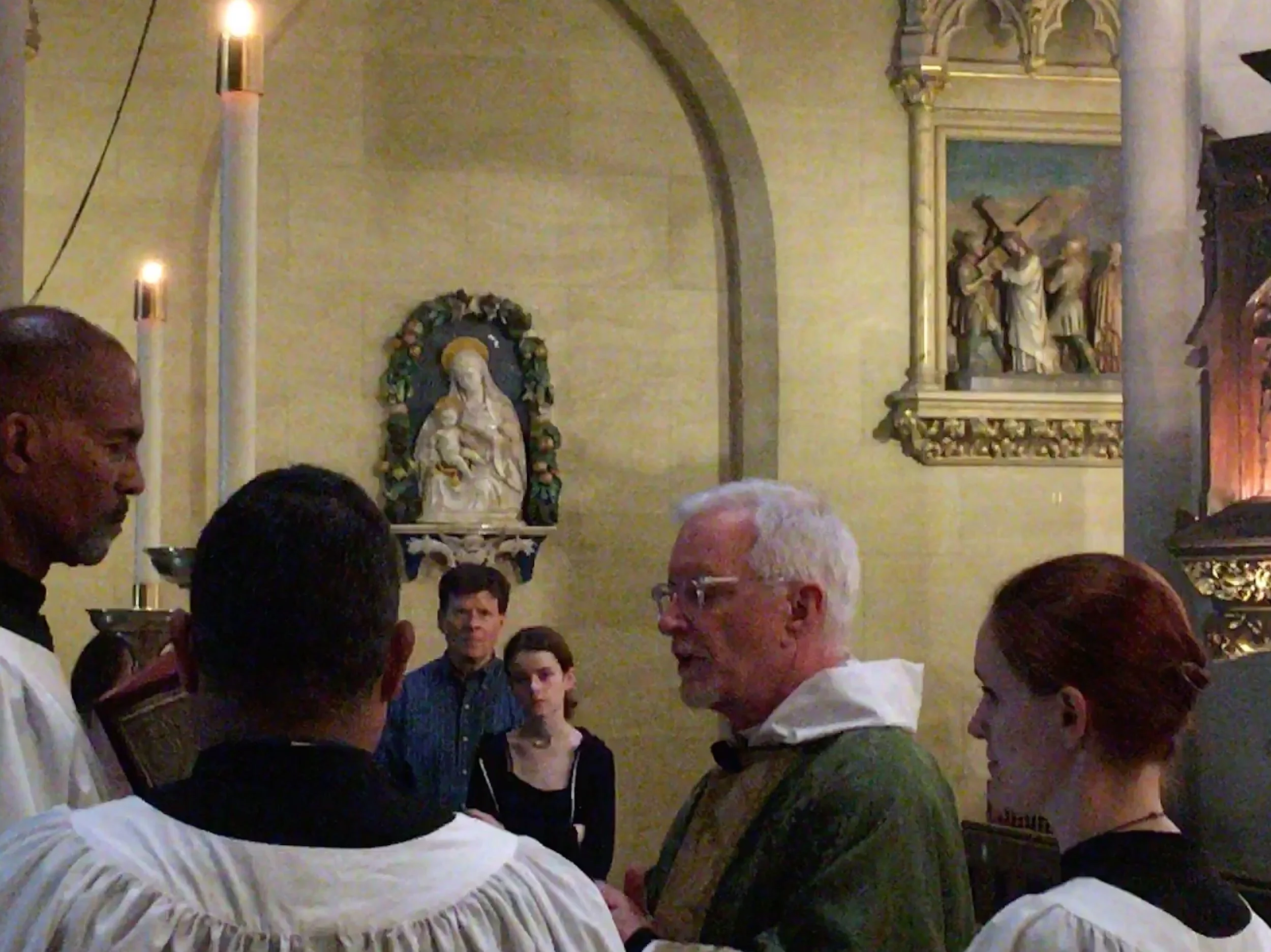Father Jim Pace proclaimed the gospel last Sunday. Foreground: (l. to r.): Charles Carson, Luis Reyes, Fr. Pace, Grace Mudd. In the background: Dale Reynolds and Joanna Reynolds. Photo: Renée Pecquex