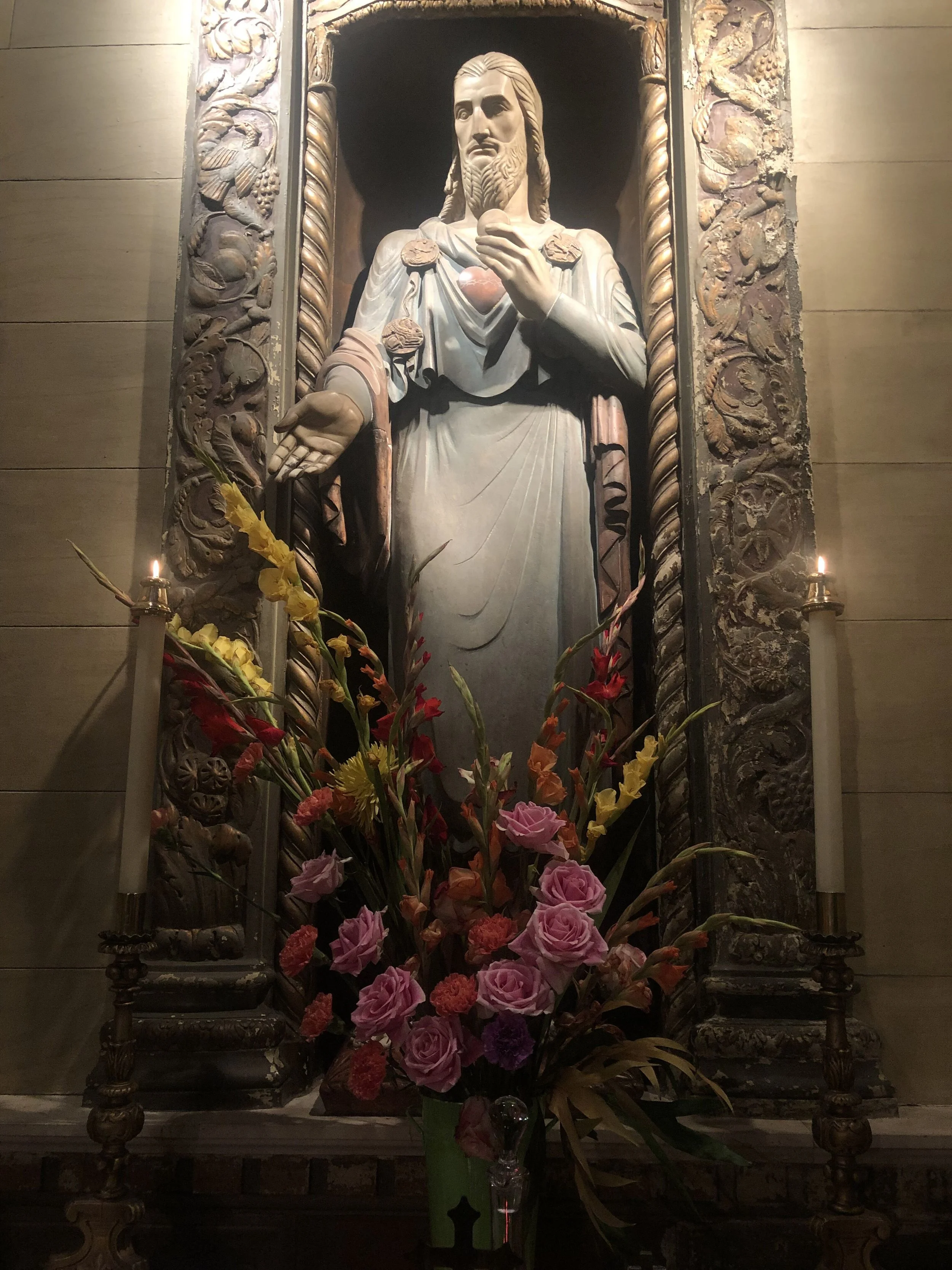 The Sacred Heart of Jesus, by Lee Lawrie (1877-1963). Flower design by Dexter Baksh. Photo: Brendon Hunte