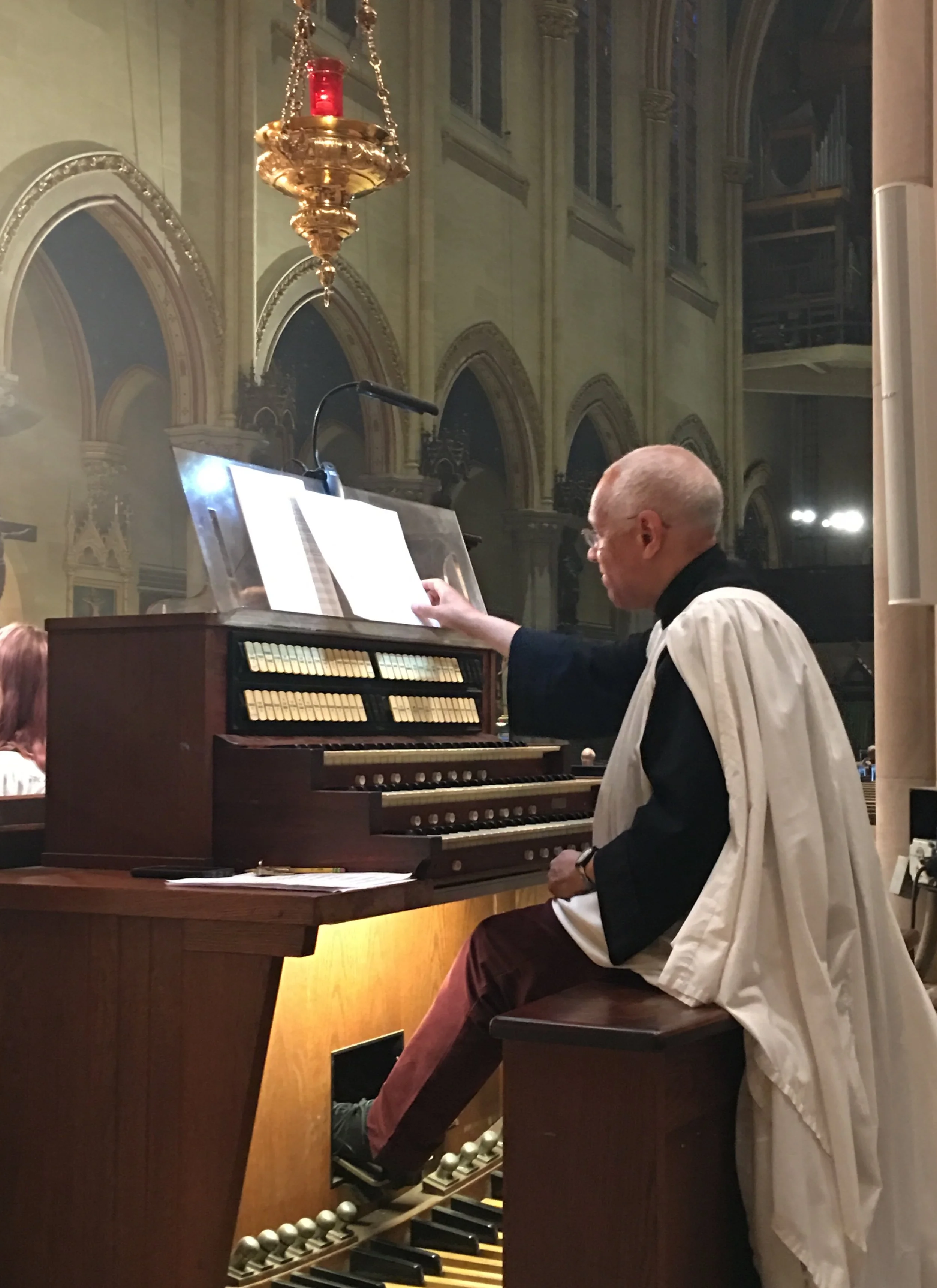 Dr. David Hurd at the organ console in the chancel during the Liturgy of the Word at the Solemn Mass. Photo: Renee Pecquex