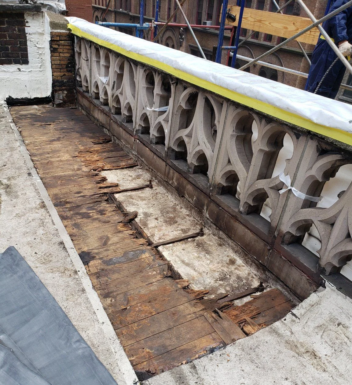 Mission House balustrade after cleaning. Some of the 1895 wood roofing material will need replacement. Photo: Milan Restoration