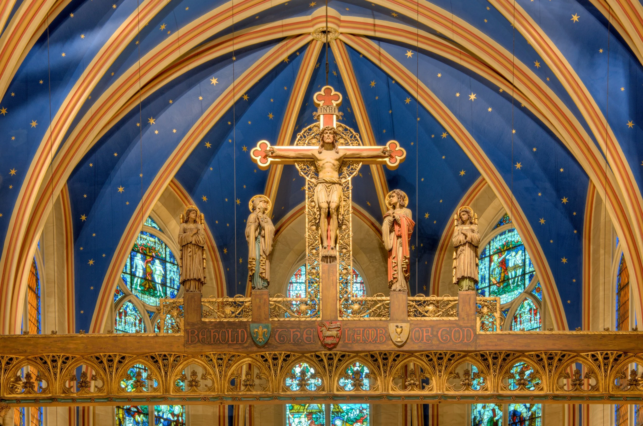 The Rood Beam at Saint Mary's (1912) by Johannes Kirchmayer (1860-1930). At the foot of the Cross stand the the Blessed Virgin and Saint John the Evangelist, flanked by two angels. Photo: Brian Kutner