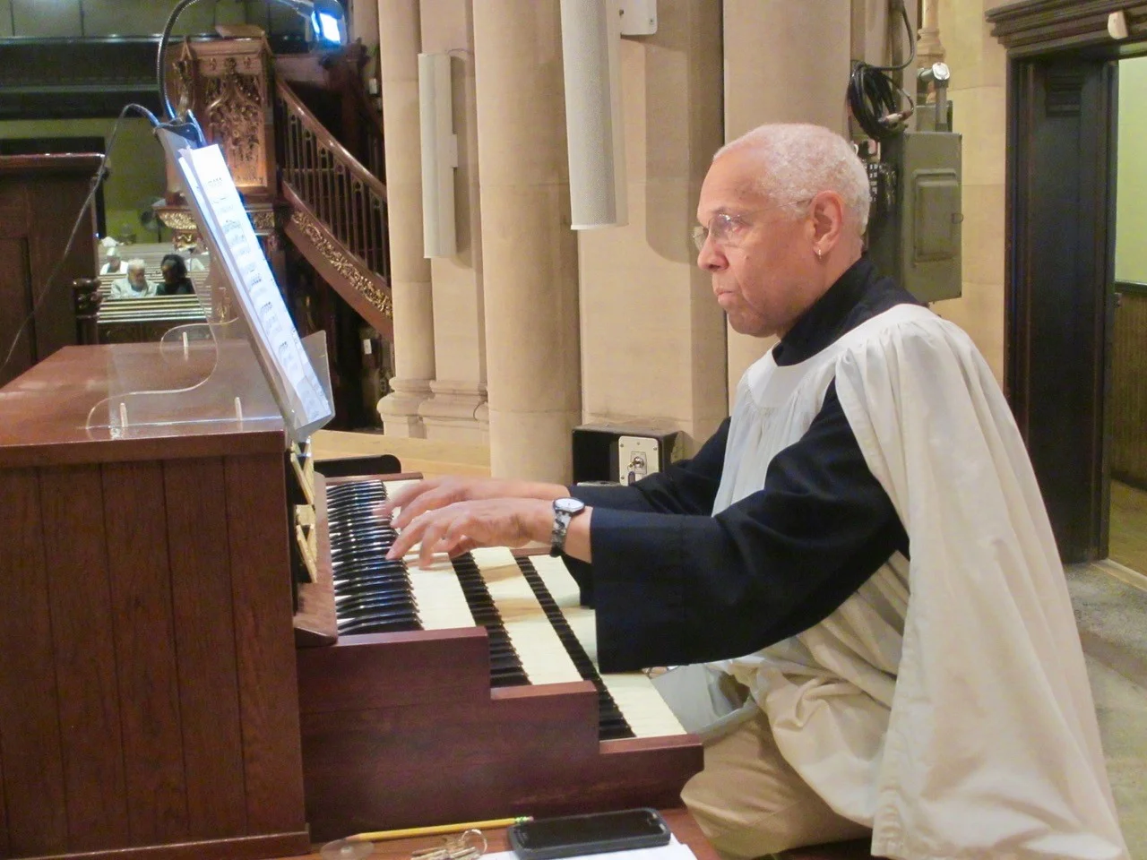 Dr. David Hurd plays the service at the downstairs console. Photo: MaryJane Boland