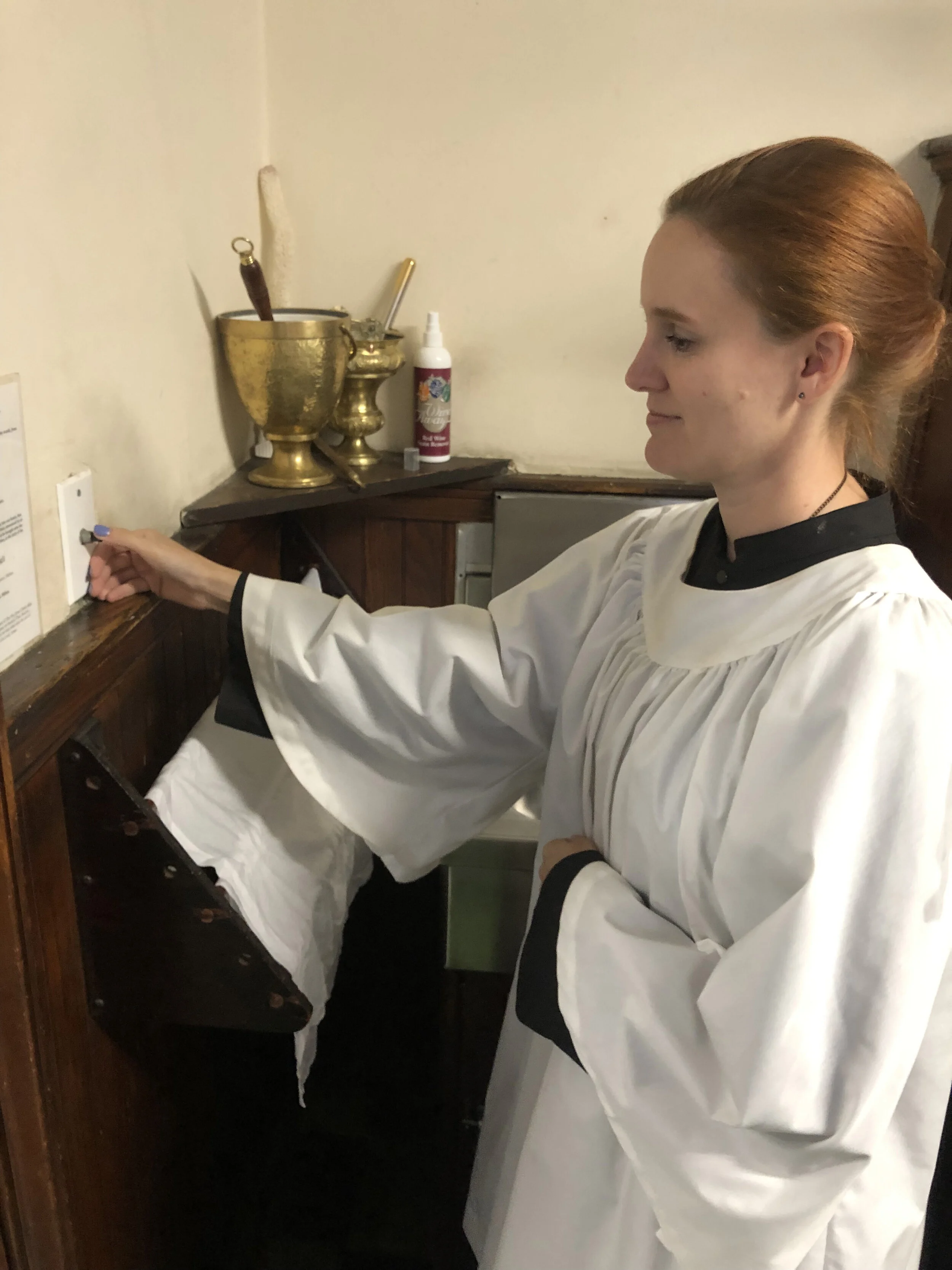 Grace Mudd was MC (master of ceremonies) for the Solemn Mass. When the organ prelude concludes, the tower chime is rung to signal the entrance of the servers and clergy. Photo: Brendon Hunter
