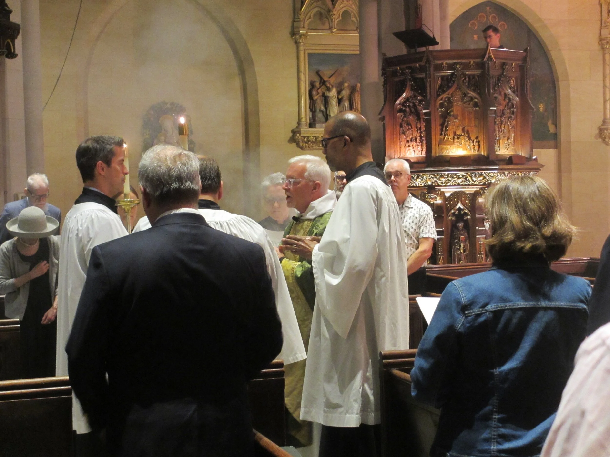 Sunday, September 22, 2019: Father Jim Pace at the beginning of the proclamation of the gospel (before the book is censed) at the Solemn Mass. After the gospel book is censed, the thurifer will stand directly behind the gospeller. Incense will continue to rise while the gospel is proclaimed. Photo: MaryJane Boland