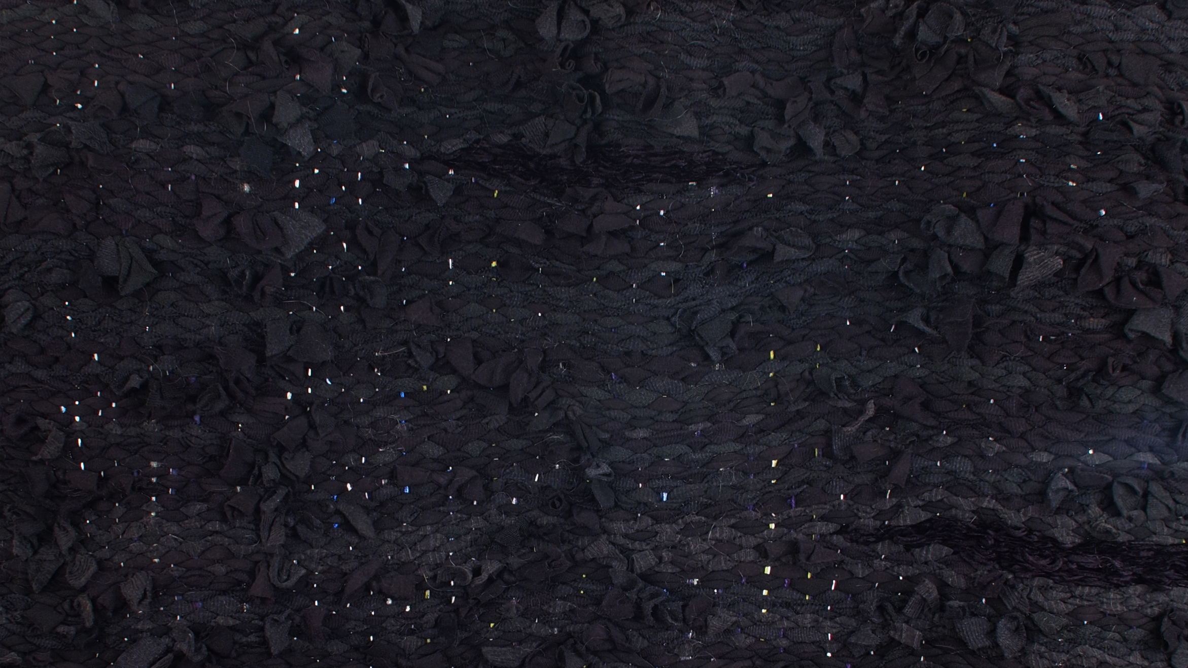 Detail image of Color Study #1 a large-scale weaving using upcycled textiles.