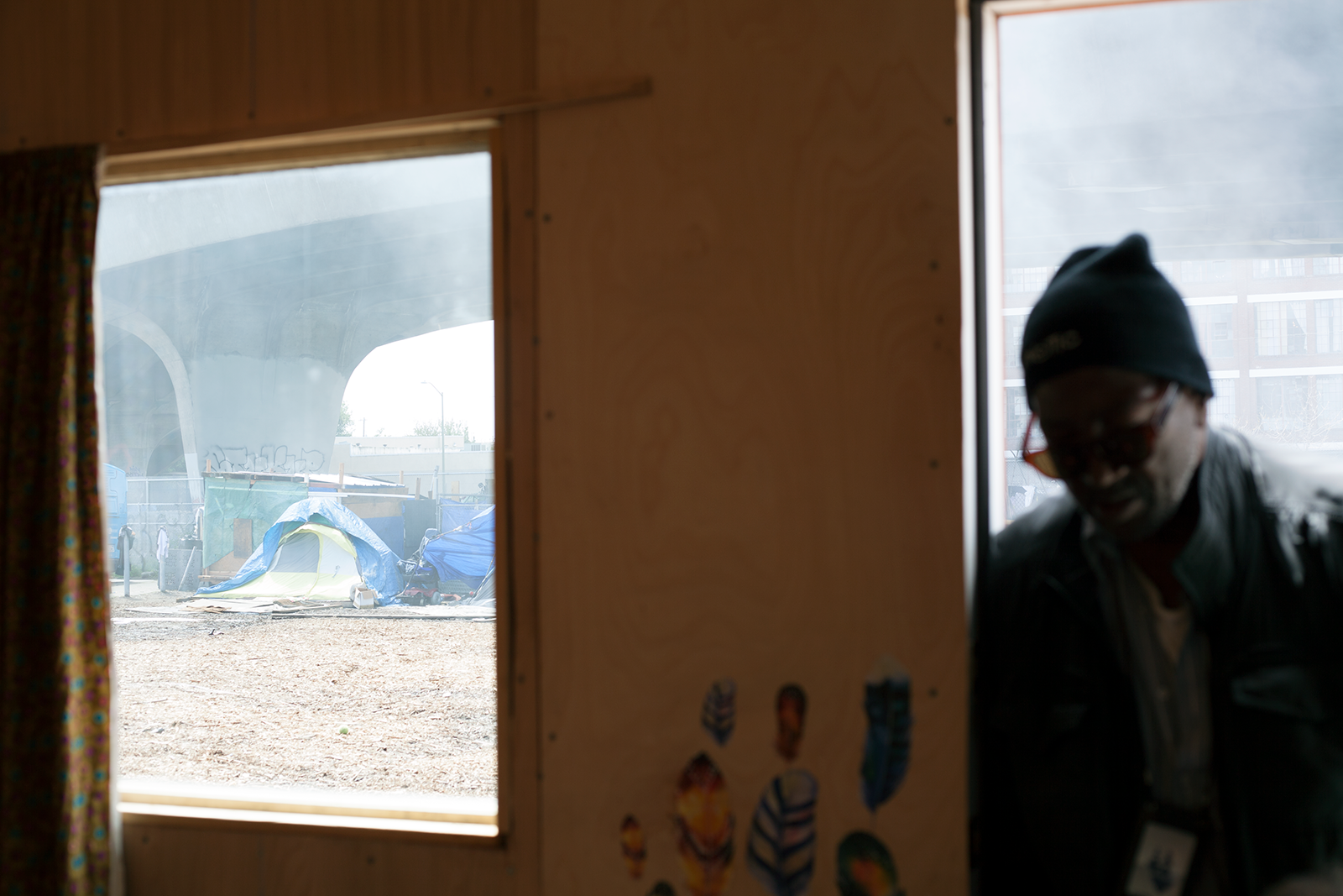 Verduzco and Griffin's (right) previous residence, a tent, can still be seen from the window of their home.