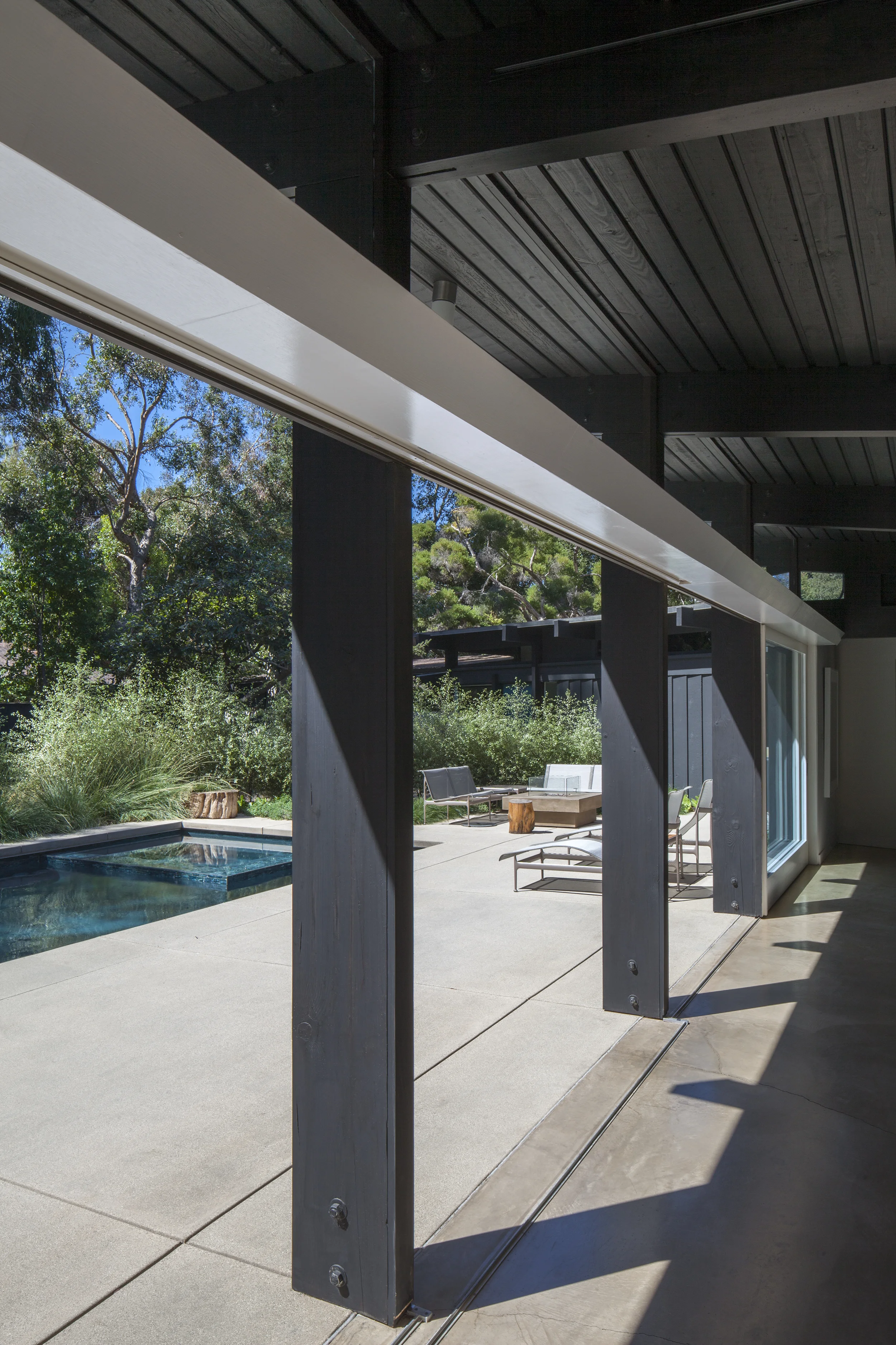 Sleek modern patio shade structure view view of minimal custom built pool - Rustic Canyon - Los Angeles garden design by Campion Walker Landscapes.jpg