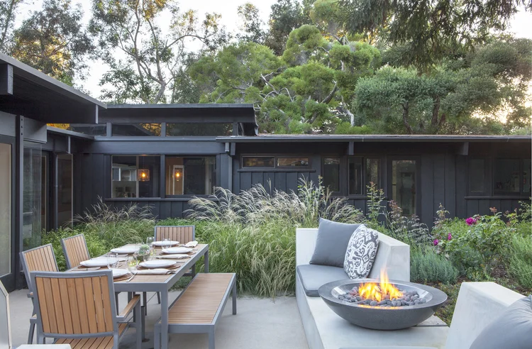 A small fire bowl brings warmth to a patio in our client’s home in Rustic Canyon.