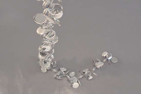 How Do I Look? , 2010 Compact mirrors, glue and monofilament, 146” x 8-1/4” x 8-1/4”